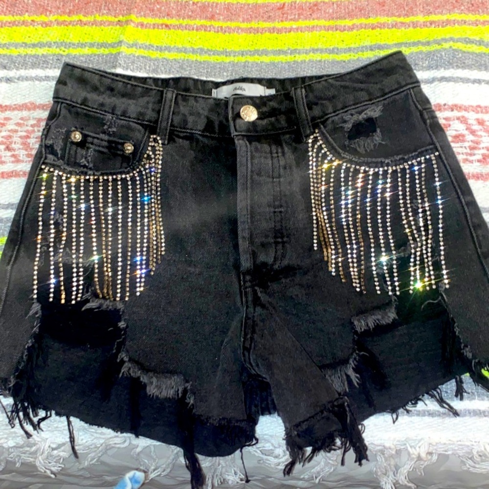Adika size small distressed jean short with rhinestone fringe on pockets. Nwot